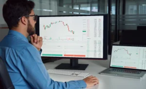 Man analyzing forex charts on MetaTrader Forex Demo Account for practice trading.