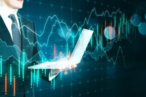 Professional trader analyzing forex charts on laptop, representing Telegram Trading Signals and their market impact.