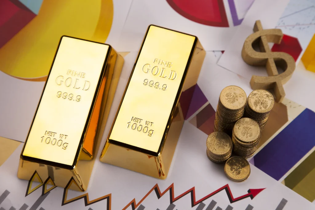 Gold bars and coins placed on financial charts reflecting investment performance in 2025.