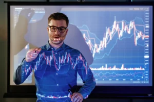 Trader explaining MACD vs Moving Averages on a live forex chart.