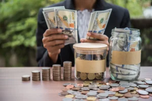 Smart Money Concepts in 2026 showing a person managing cash, coins, and savings jars representing liquidity flow and capital control