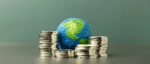 Global Investment Risk and Resilience Index concept with world globe and stacked coins showing economic resilience in 2025.