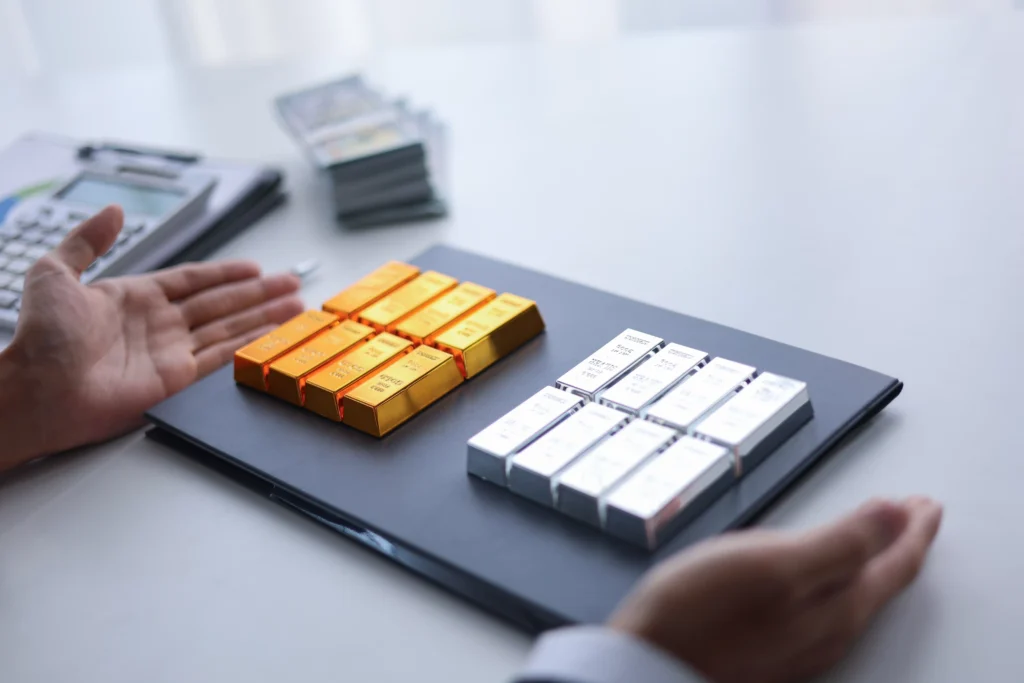 Silver and gold price forecast 2026 showing physical gold and silver bars for long-term investment planning